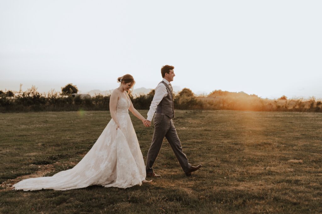 Photographer capturing golden hour portraits at Jimmy’s Farm wedding