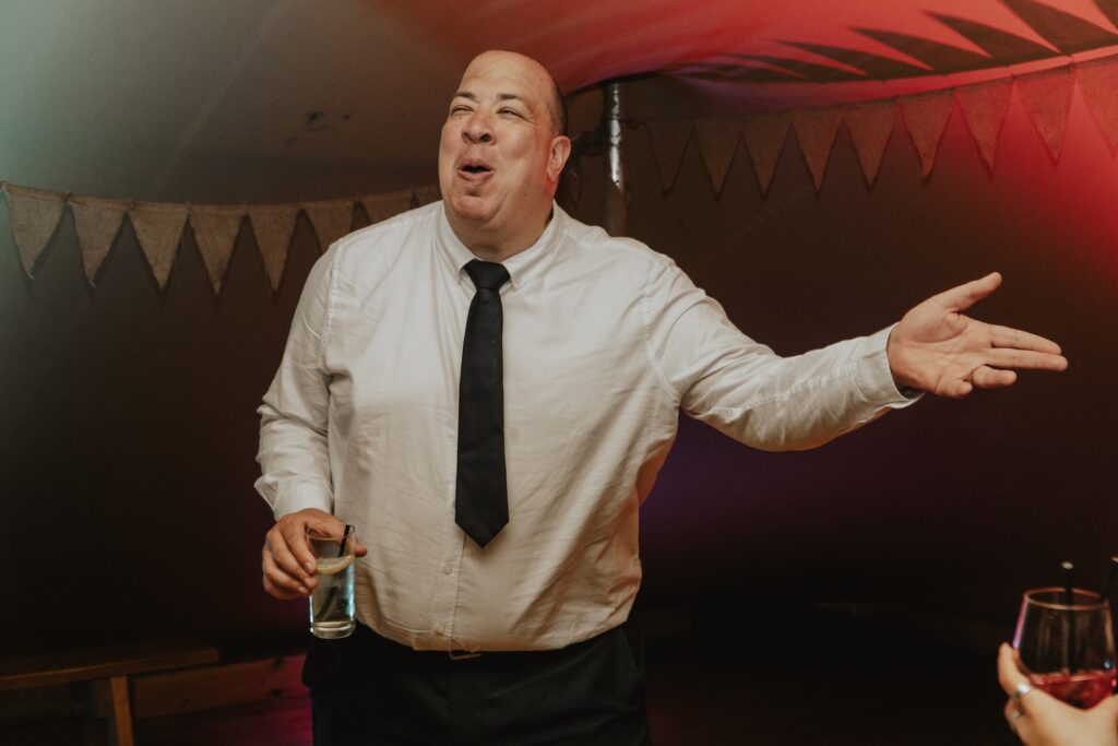 Guests dancing at Jimmy's Farm during the evening party by Suffolk wedding photographer