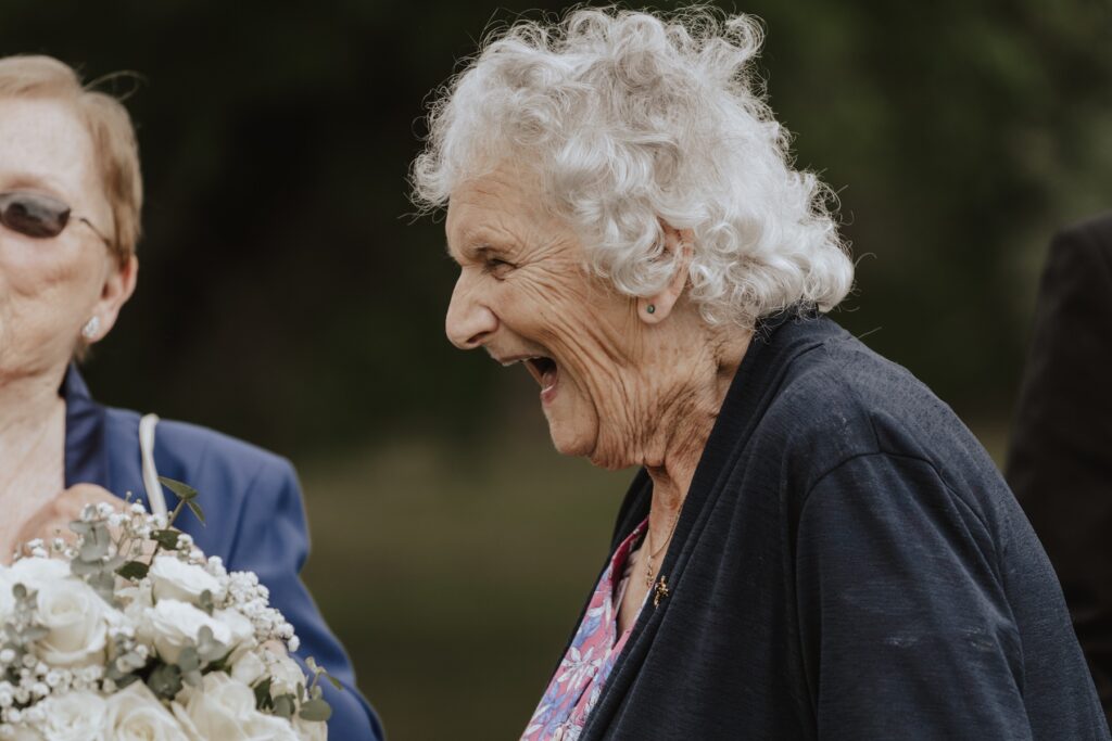 Candids of guests chatting by the garden terrace
