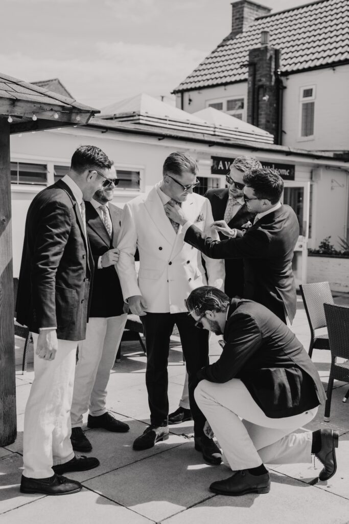 Yorkshire wedding photographer capturing groom and groomsmen prep