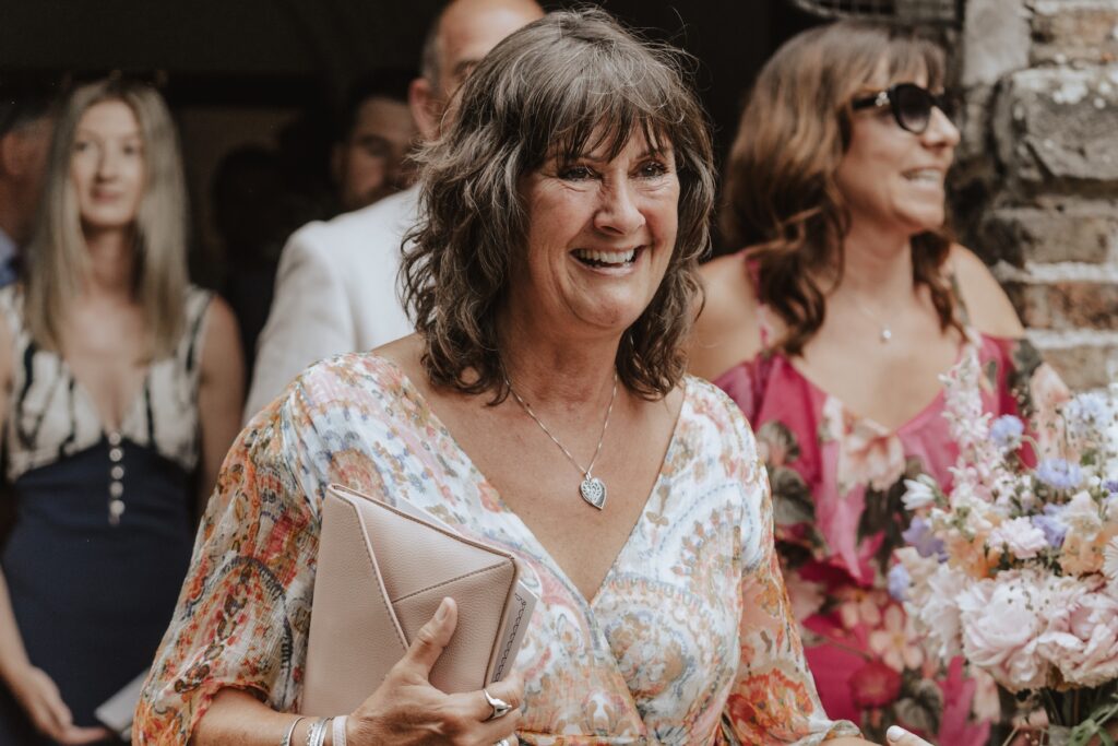 Yorkshire wedding photographer capturing laughter and hugs after the ceremony