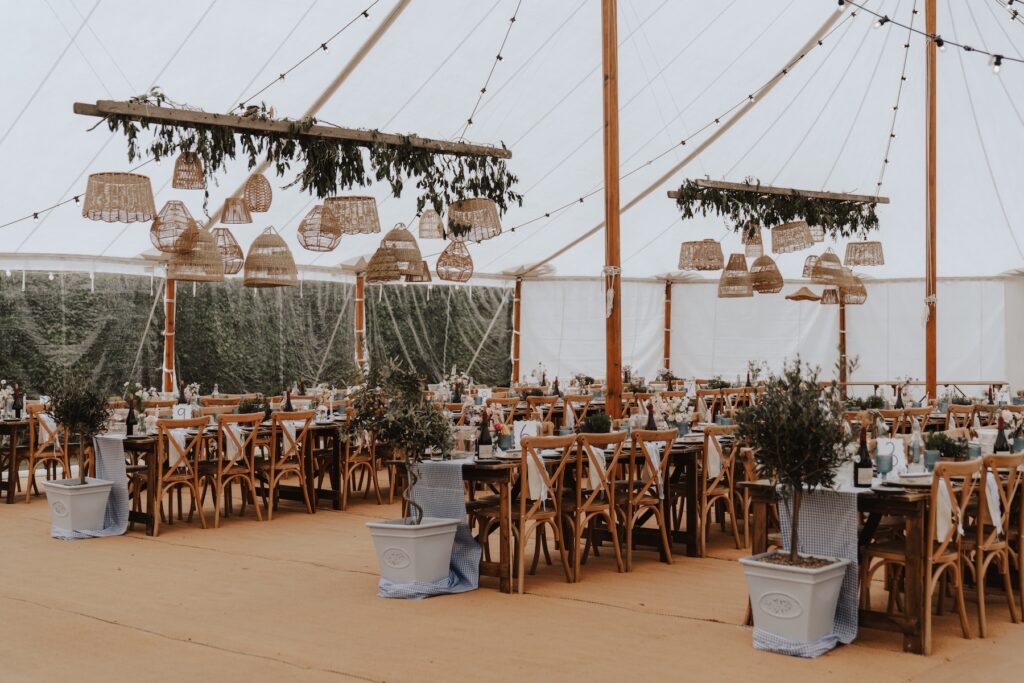 Beautiful marquee setup in the family garden with long banquet tables
