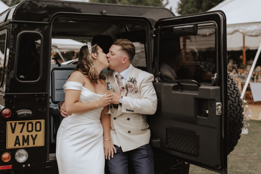 Bride and groom having a drink during their drinks reception