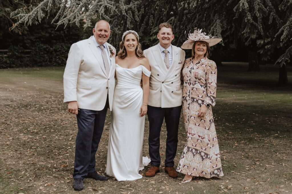 Bride and groom having family portraits on their wedding day