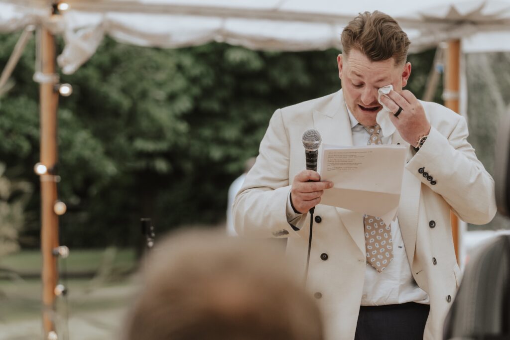 Yorkshire wedding photographer capturing the groom crying during speeches