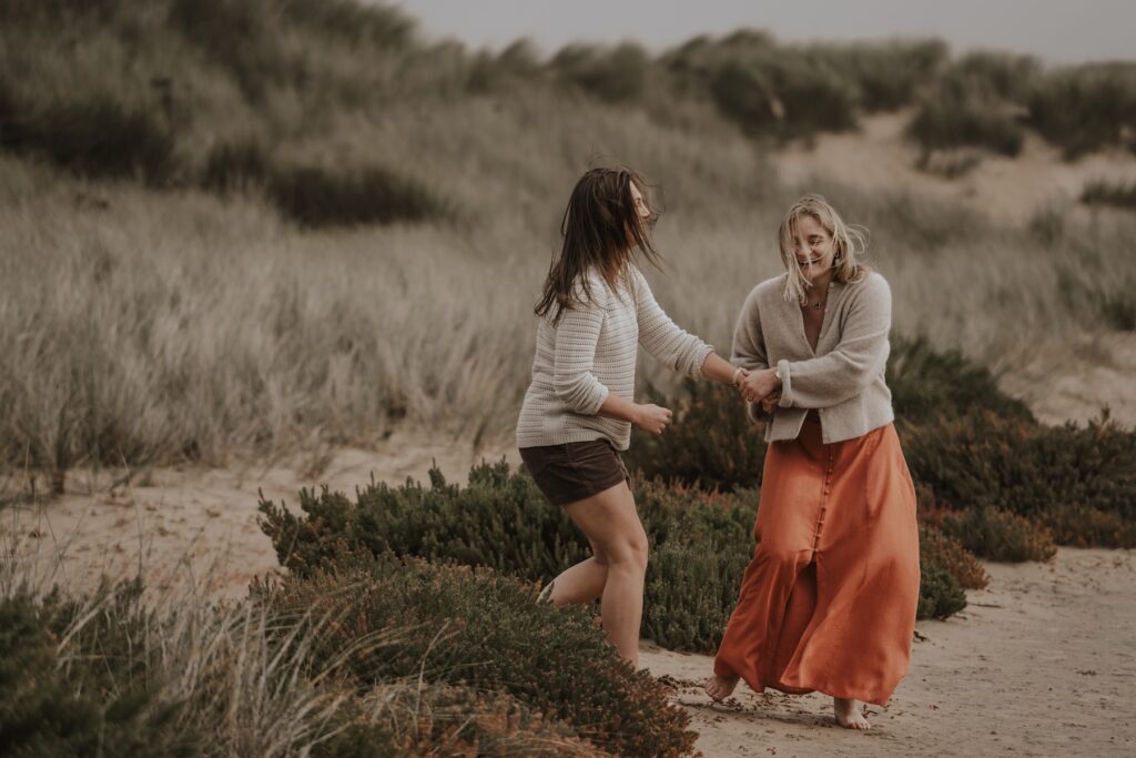 Engagement photographer capturing a couple on the beach at Holkham