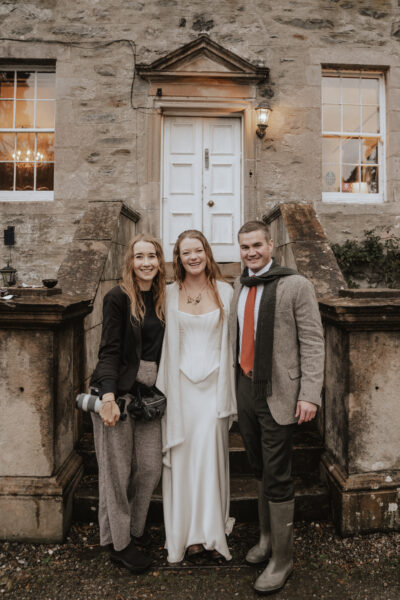 Wedding photographer with bride and groom for about me page