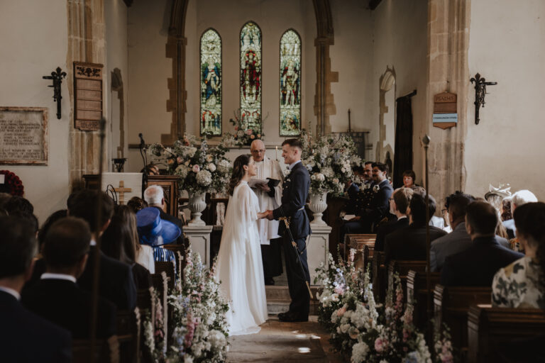 Bride and groom during a church ceremony on their wedding in Suffolk