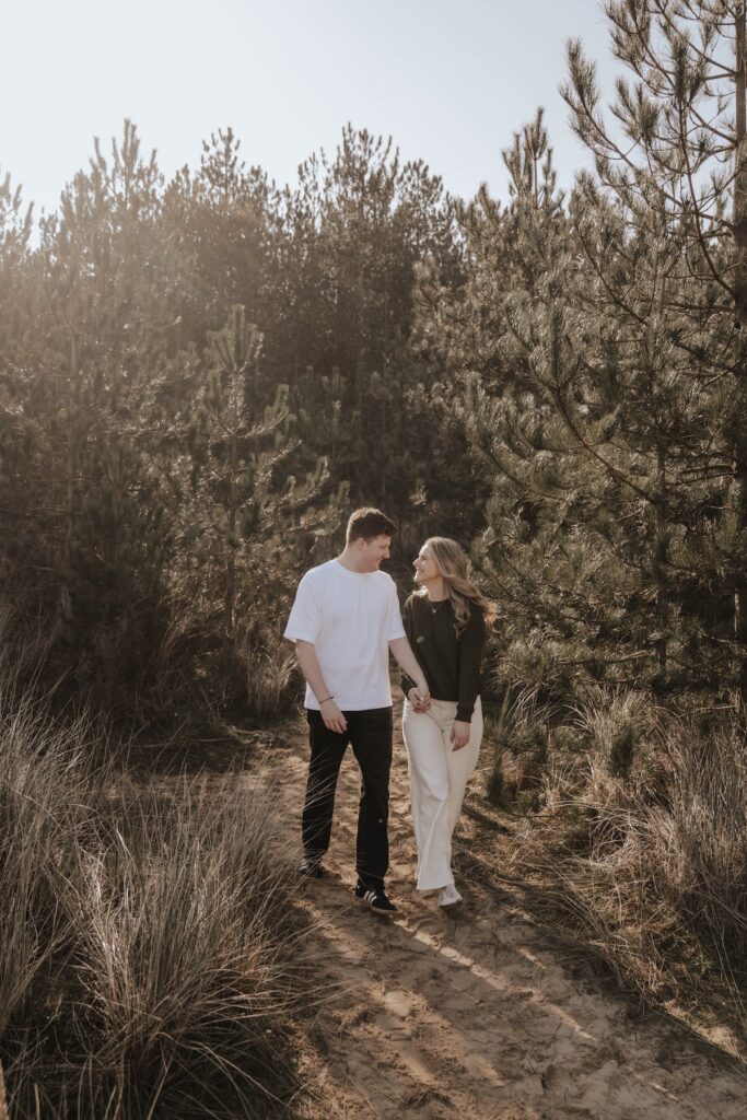 Norfolk engagement photographer capturing a couple at Holkham beach