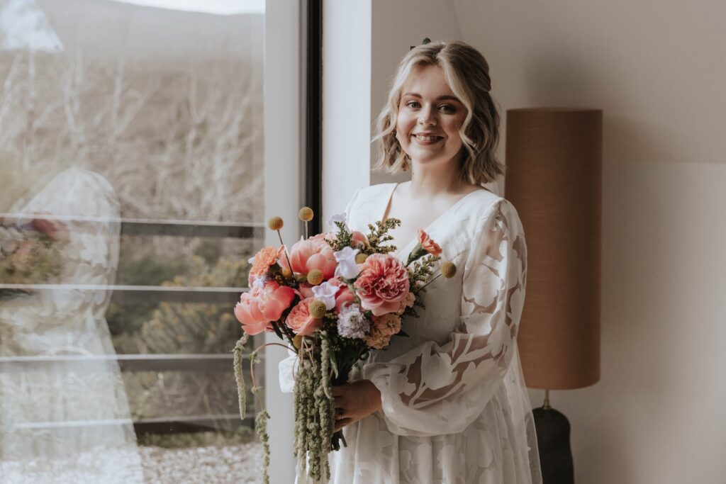 Colourful wedding bouquet against the dramatic Skye landscape