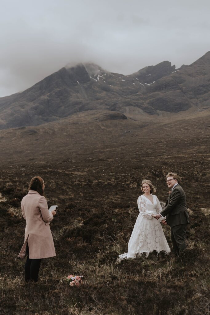 Bride and groom exchanging vows at quiet Sligachan ceremony location on Skye