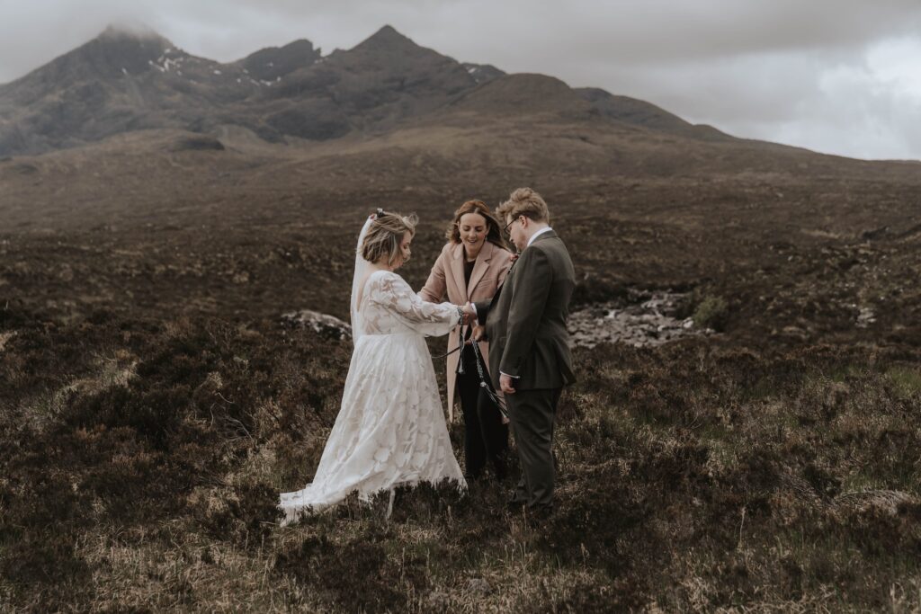 The bride and groom during their intimate elopement ceremony on Skye