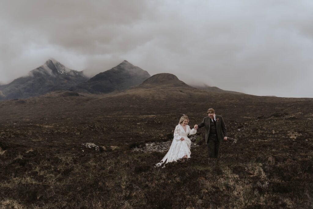 Newlyweds exploring sligachan on the Isle of Skye during their elopement