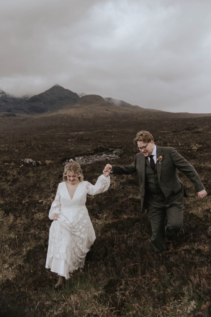 A couple adventuring on their Scotland elopement