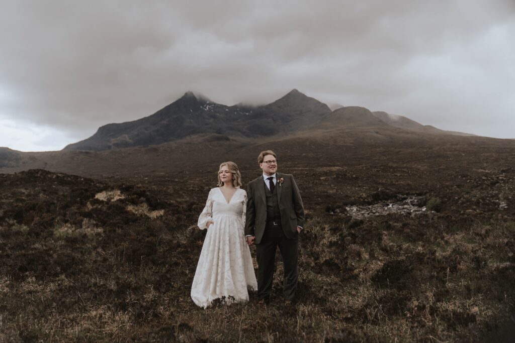 Bride and groom pose on the Isle of Skye for elopement photos