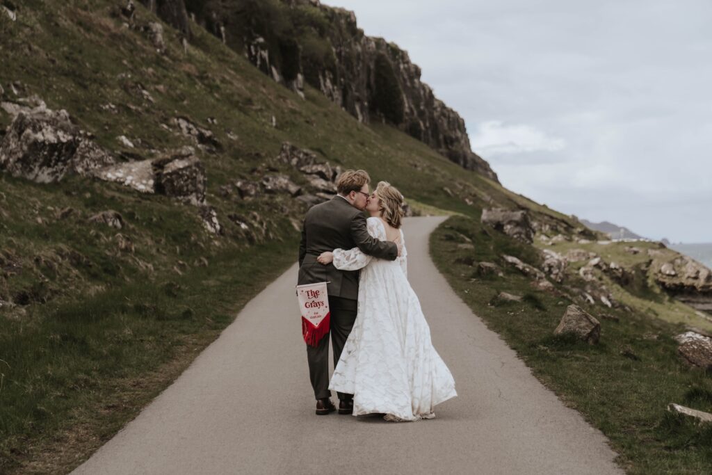 Couple walking together at An Corran Beach on the Isle of Skye