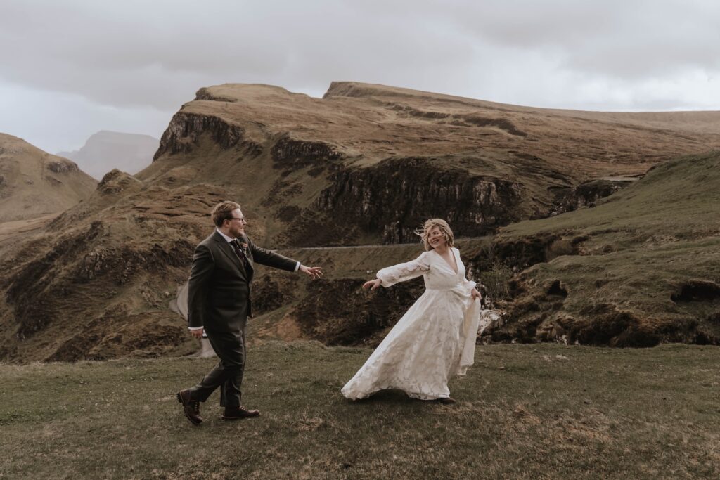 Couple embracing with mountain views at The Quiraing