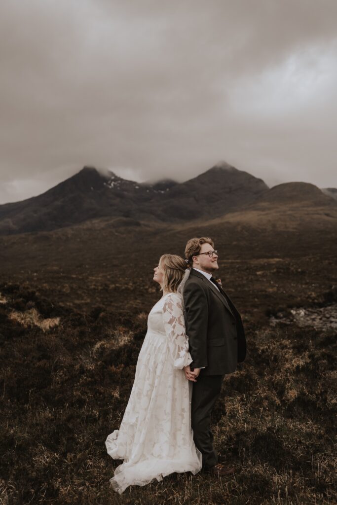 Elopement photographer capturing a couple on their elopement on the Isle of Skye with the Cuillin mountains