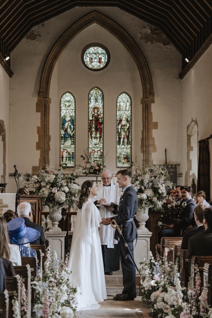A Suffolk church with a bride and groom exchanging vows