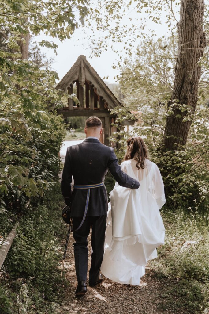 A bride and groom leaving their church after their wedding ceremony