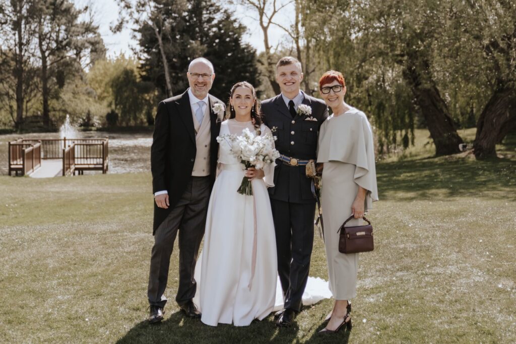Formal photos taken during the drinks reception at a wedding at Seckford Hall
