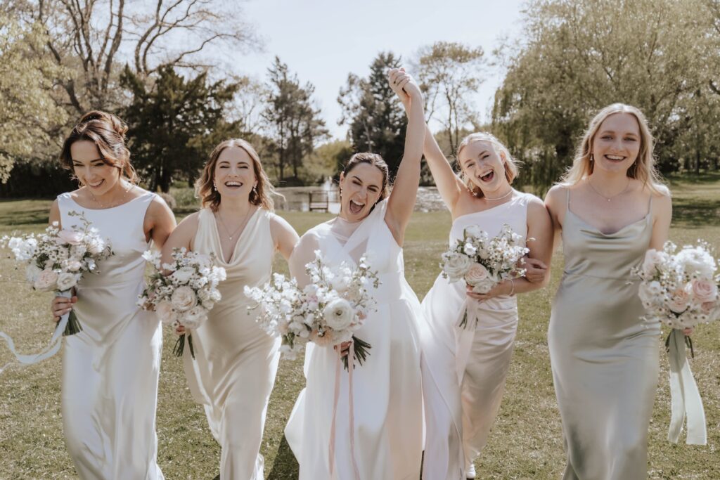 Fun formal photos taken during the drinks reception at a wedding at Seckford Hall