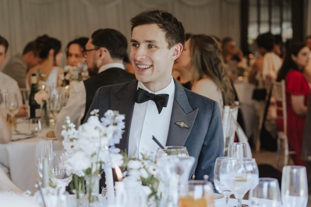 Candid moments of wedding guests during speeches at Seckford Hall