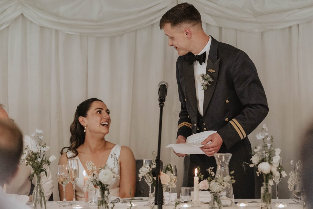 Candid moments of wedding guests during speeches at Seckford Hall