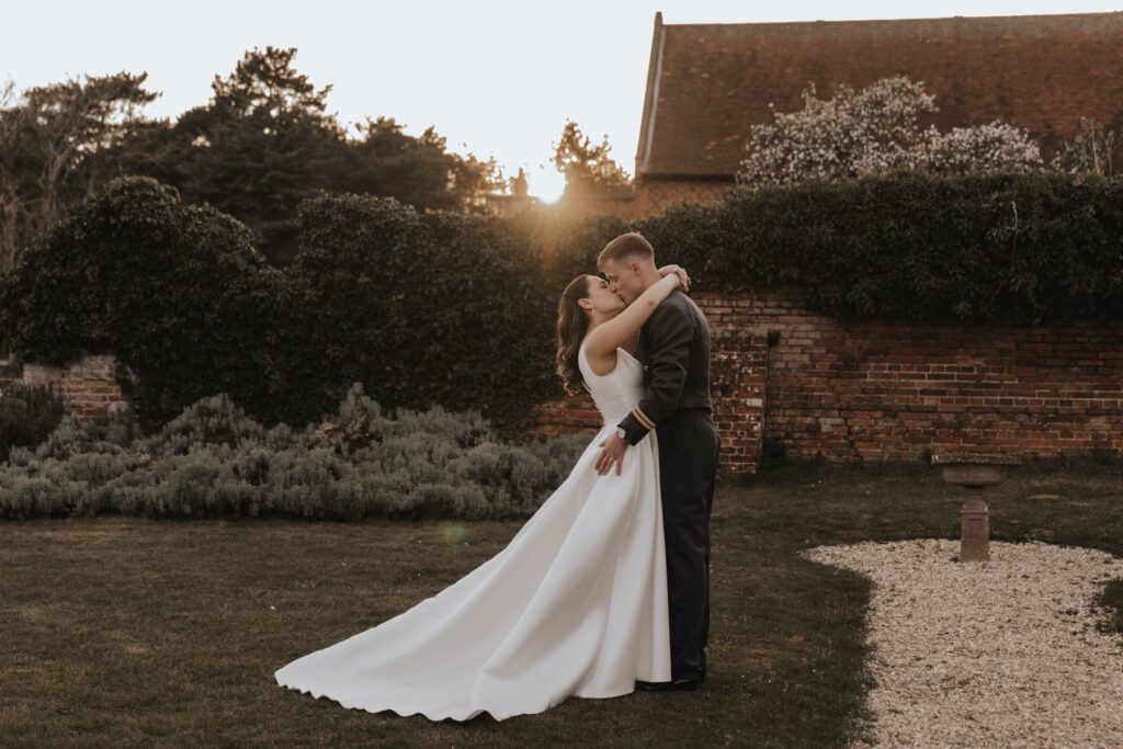 Sunset couple portraits of a bride and groom at Seckford Hall