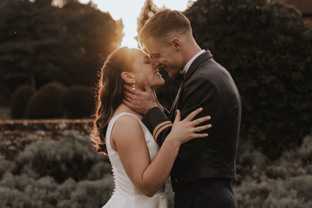 Golden hour couple portraits of a bride and groom at Seckford Hall in Suffolk