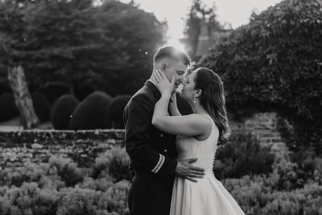 Golden hour couple portraits of a bride and groom at Seckford Hall