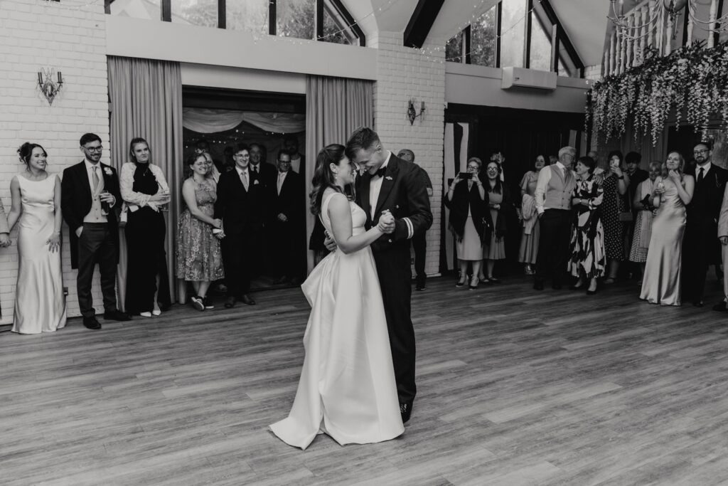 A bride and groom having their first dance at Seckford Hall
