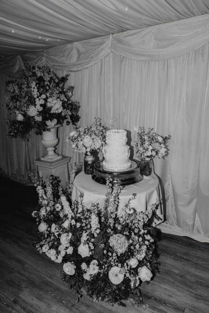 A bride and groom at Seckford Hall cutting their wedding cake