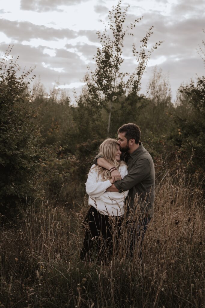A couple on their engagement session at Heartwood Forest near St Albans