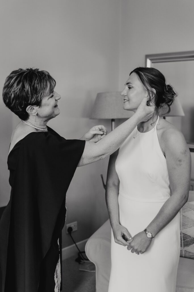 Bride with her bridesmaids during morning preparations in Scotland