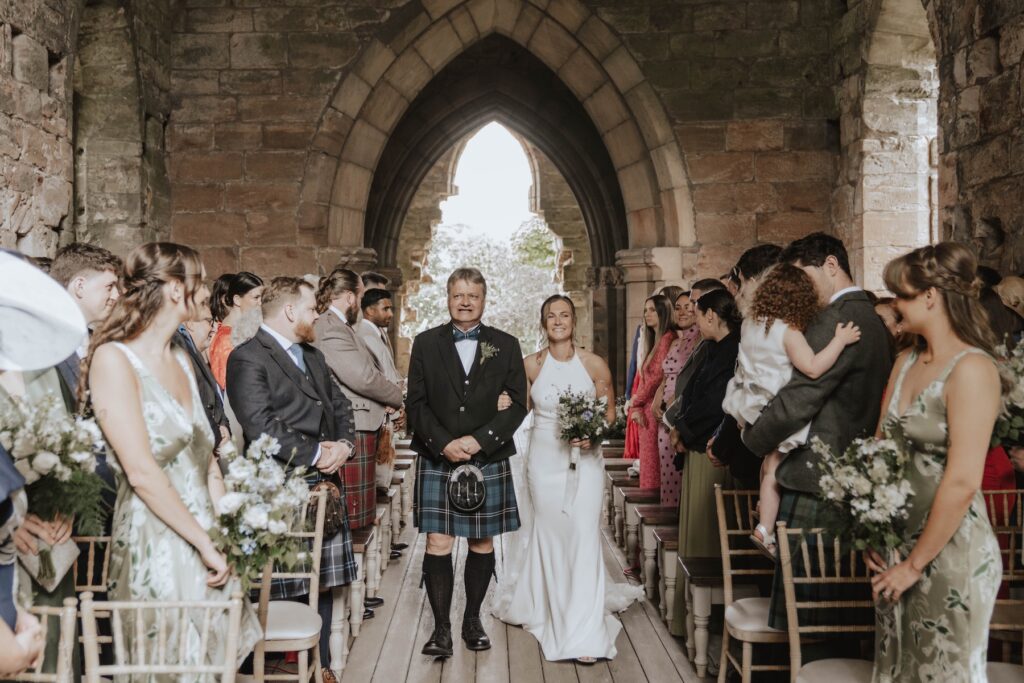 Bride walking down the aisle at Dunglass Estate wedding venue