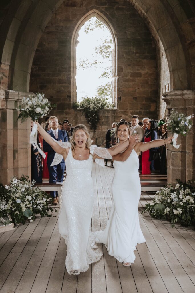 Scotland wedding photographer capturing Dunglass Estate couple walking down the aisle after ceremony