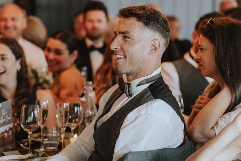 Wedding guests reacting during speeches