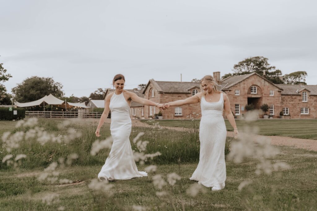 Brides walking together during soft evening light