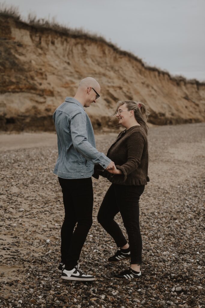 A couple having a session on Covehithe beach