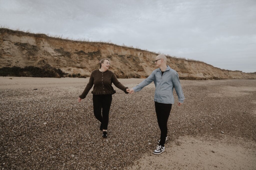 Covehithe beach with a couple in Suffolk