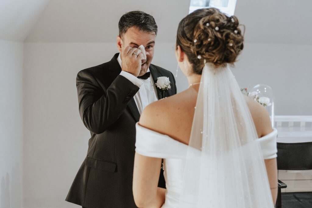 Emotional father and daughter moment during wedding preparations at Gaynes Park