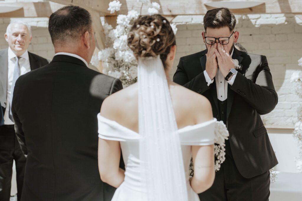 Emotional groom Josh seeing his bride for the first time at Gaynes Park