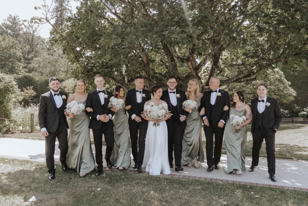Abbie and Josh with their bridesmaids at Gaynes Park