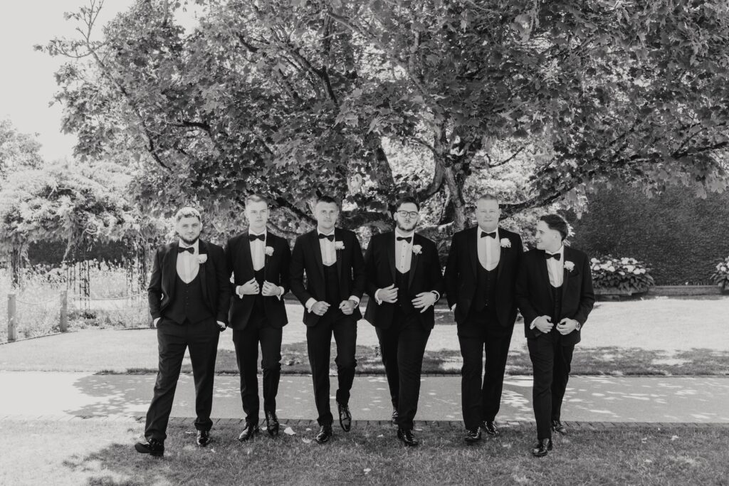 Groomsmen posing together at Abbie and Josh's wedding