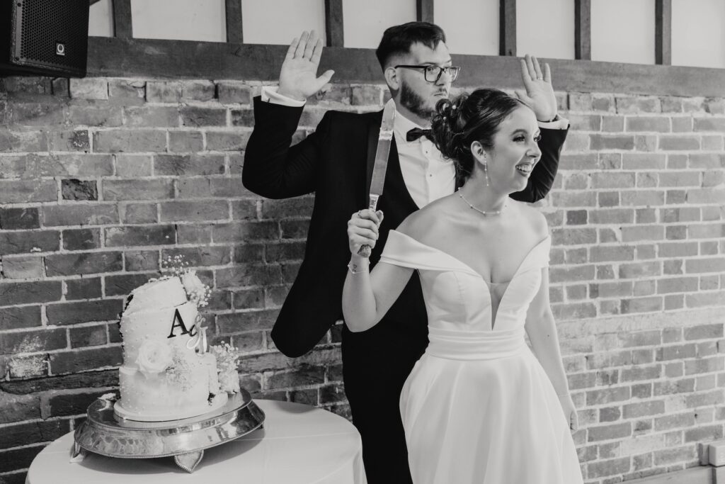 Bride Abbie joking with guests during the wedding cake cutting