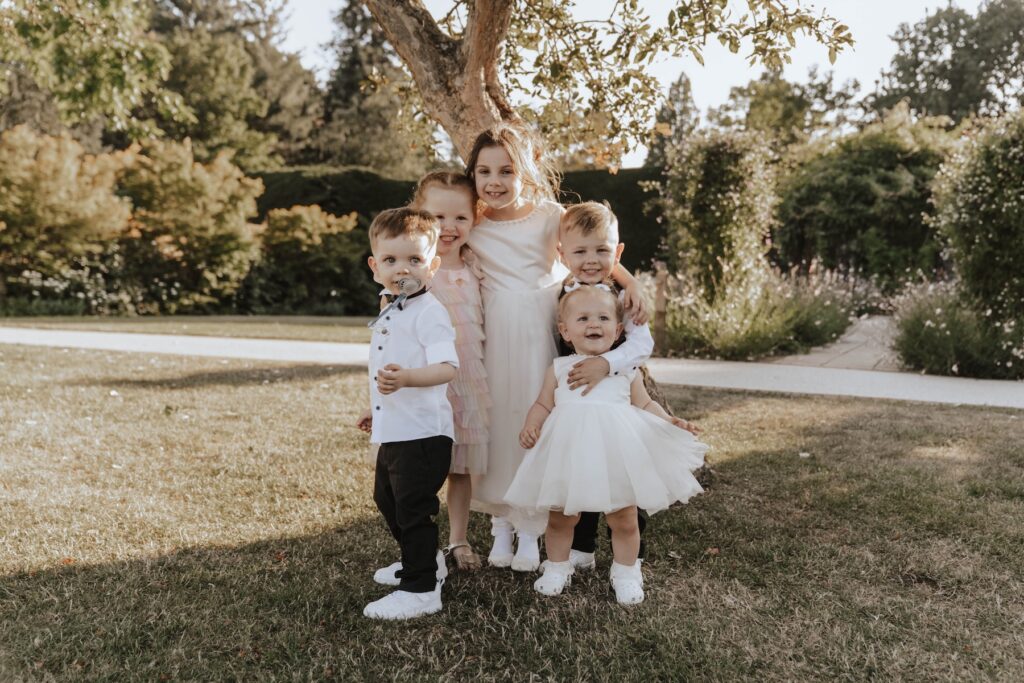 Wedding guests enjoying cocktails outside at Gaynes Park