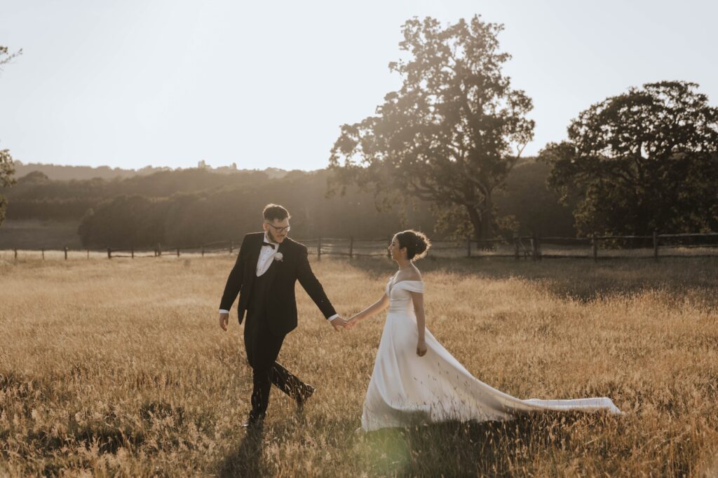 Golden light filtering through the grass during an Essex wedding