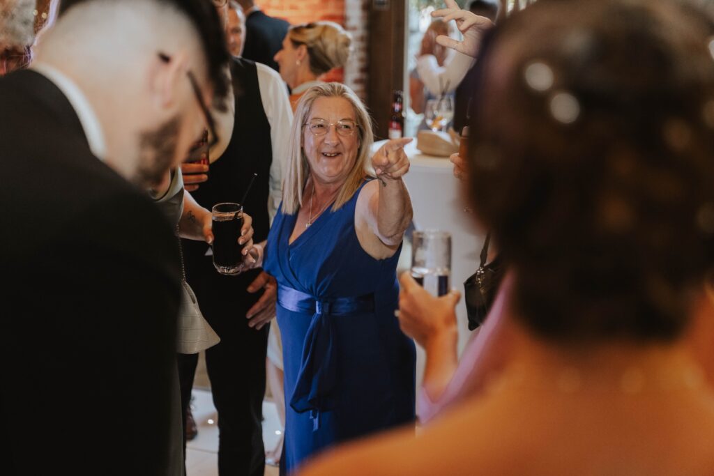 Wedding guests dancing at Abbie and Josh's Gaynes Park wedding