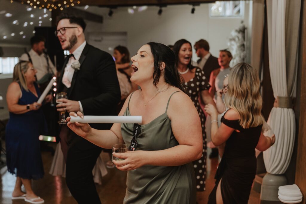 Abbie and Josh dancing with their friends during the evening reception
